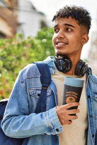 A smiling young man with a goodcup